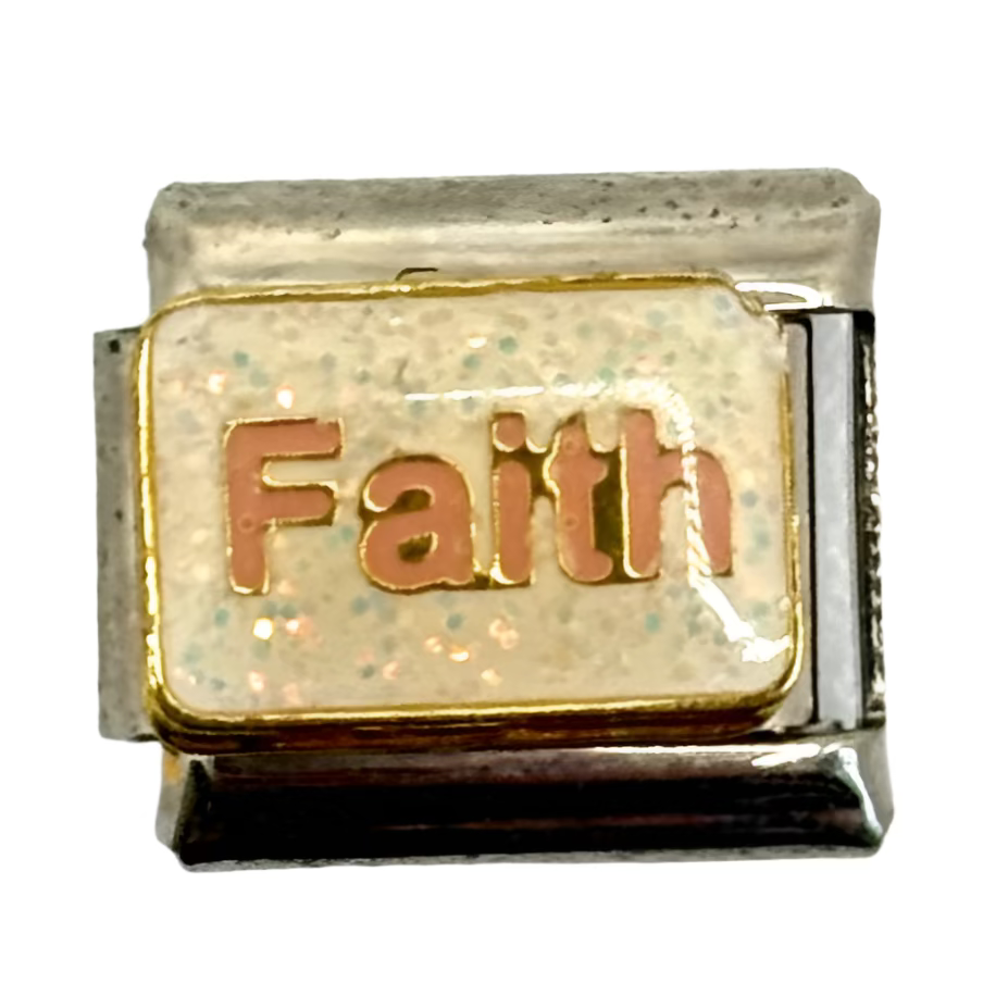 Gold charm with 'Faith' engraved on a white background