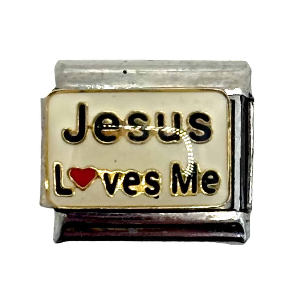 Silver charm with 'Jesus loves me' text on a white background