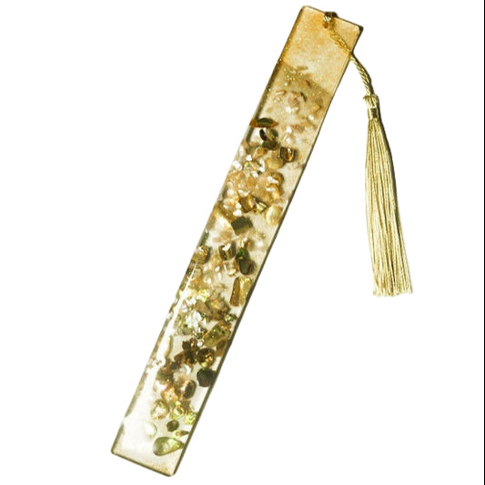 Orange background bookmark with various shades of orange and brown small rock crystals