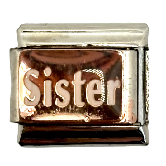 Rose gold 'Sister' charm on a white background