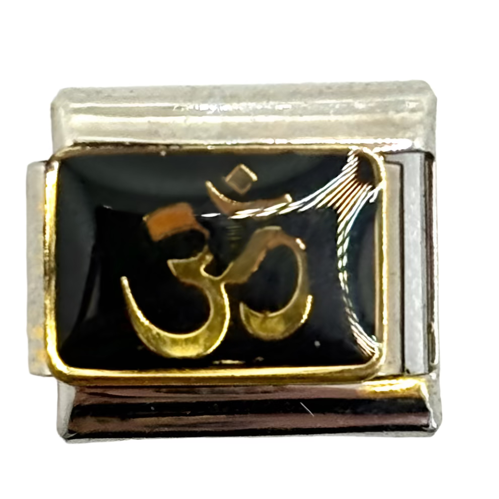 Small square charm with a gold symbol on a white background